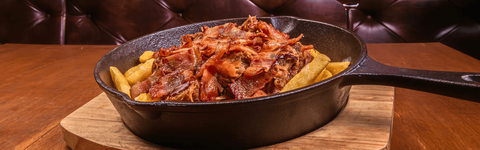 Bed of French fries, topped with pulled pork, served at Big Boys’ Burger Club in Kamala, Patong and Rawai Beach